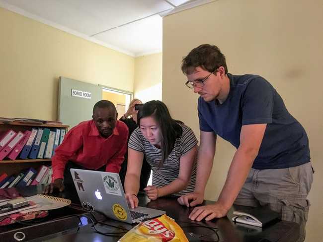 Michael Nekrasov examining network setup at a HIV center